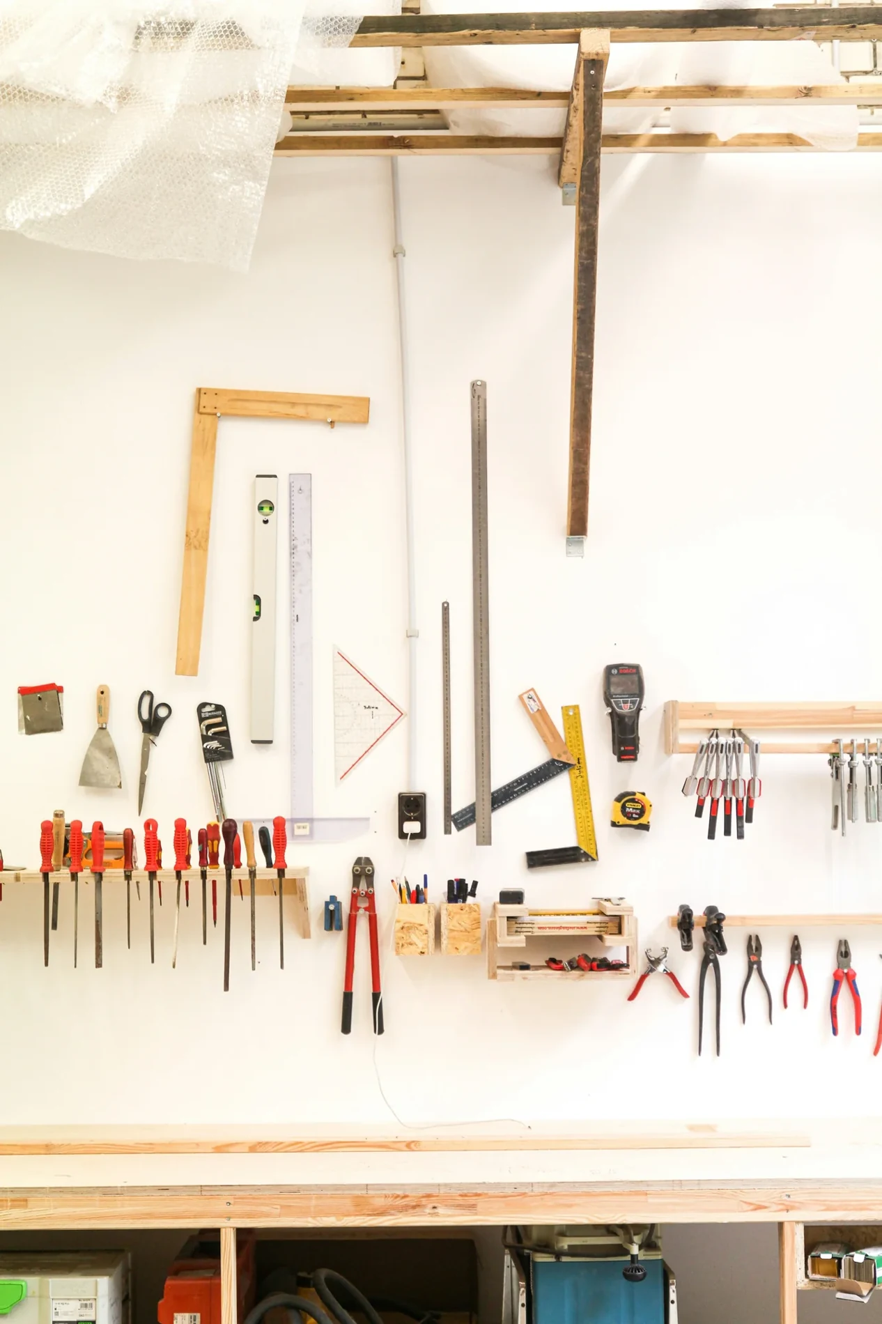 Tools arranged on a workshop wall — editorial context for technical documentation
